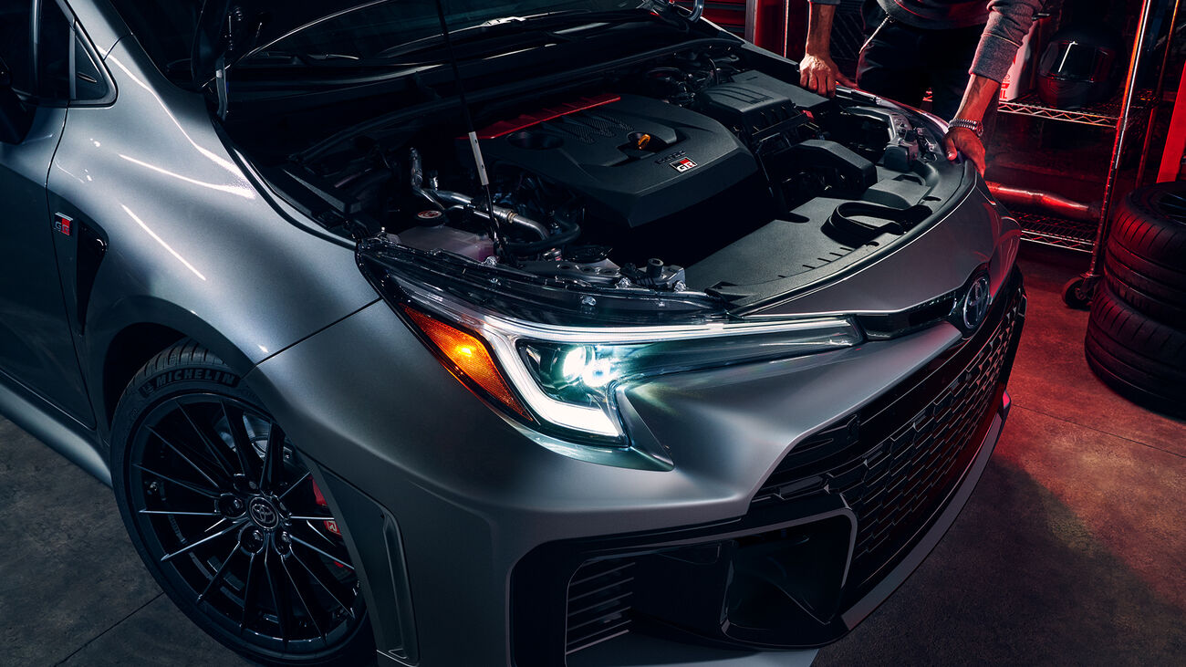 GR Corolla Premium Plus in Heavy Metal with its hood open and 3-cylinder turbocharged engine visible