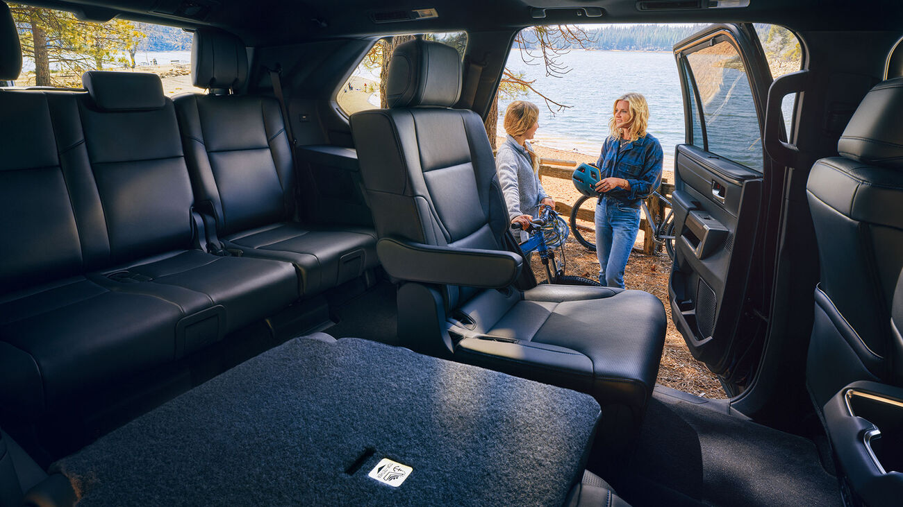 2026 Toyota Sequoia with its second-row seating folded down. Allowing access to the third row of seating.