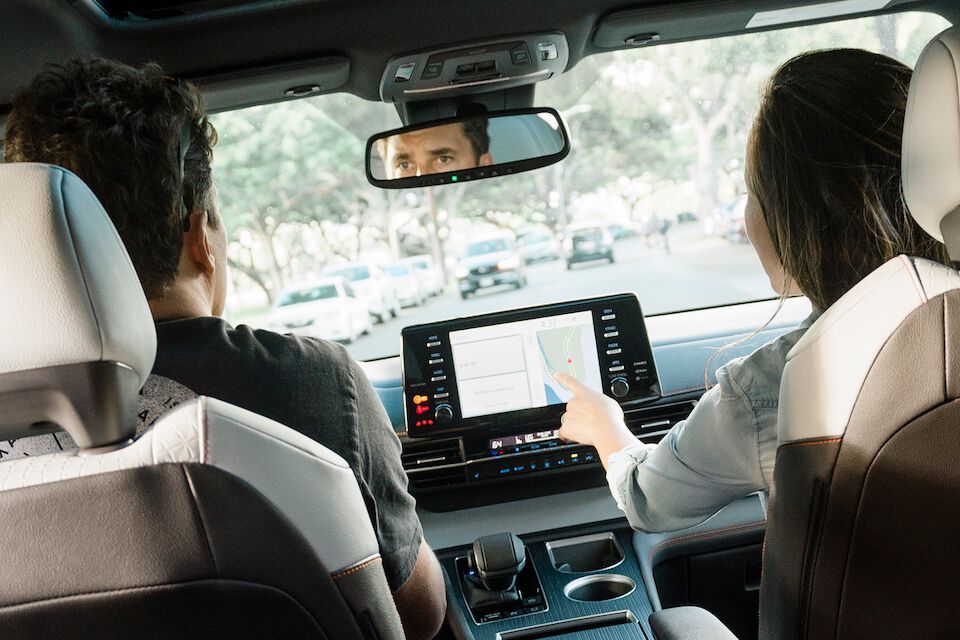 Passenger engaging with the Toyota multimedia display