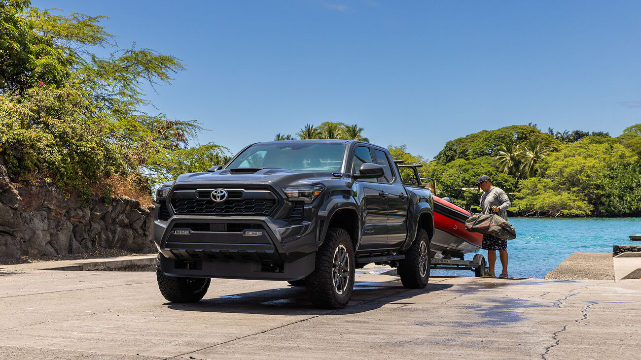 The Toyota Tacoma i-FORCE MAX TRD Sport in Underground towing a small boat from the boat harbor.