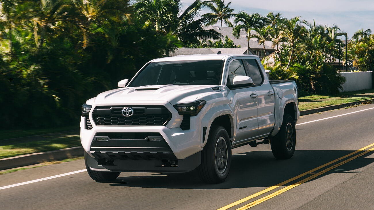 Tacoma i-FORCE MAX driving down a Hawaii residential street
