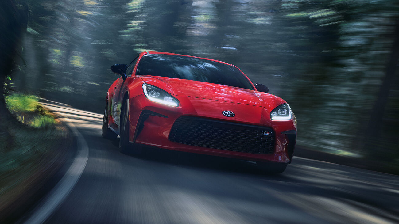 Toyota GR86 Premium in Track bRED cornering on a racetrack