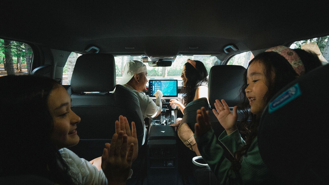 A mother and father along with their two daughters inside the 2026 Toyota 4Runner TRD Sport gearing up for an adventure.