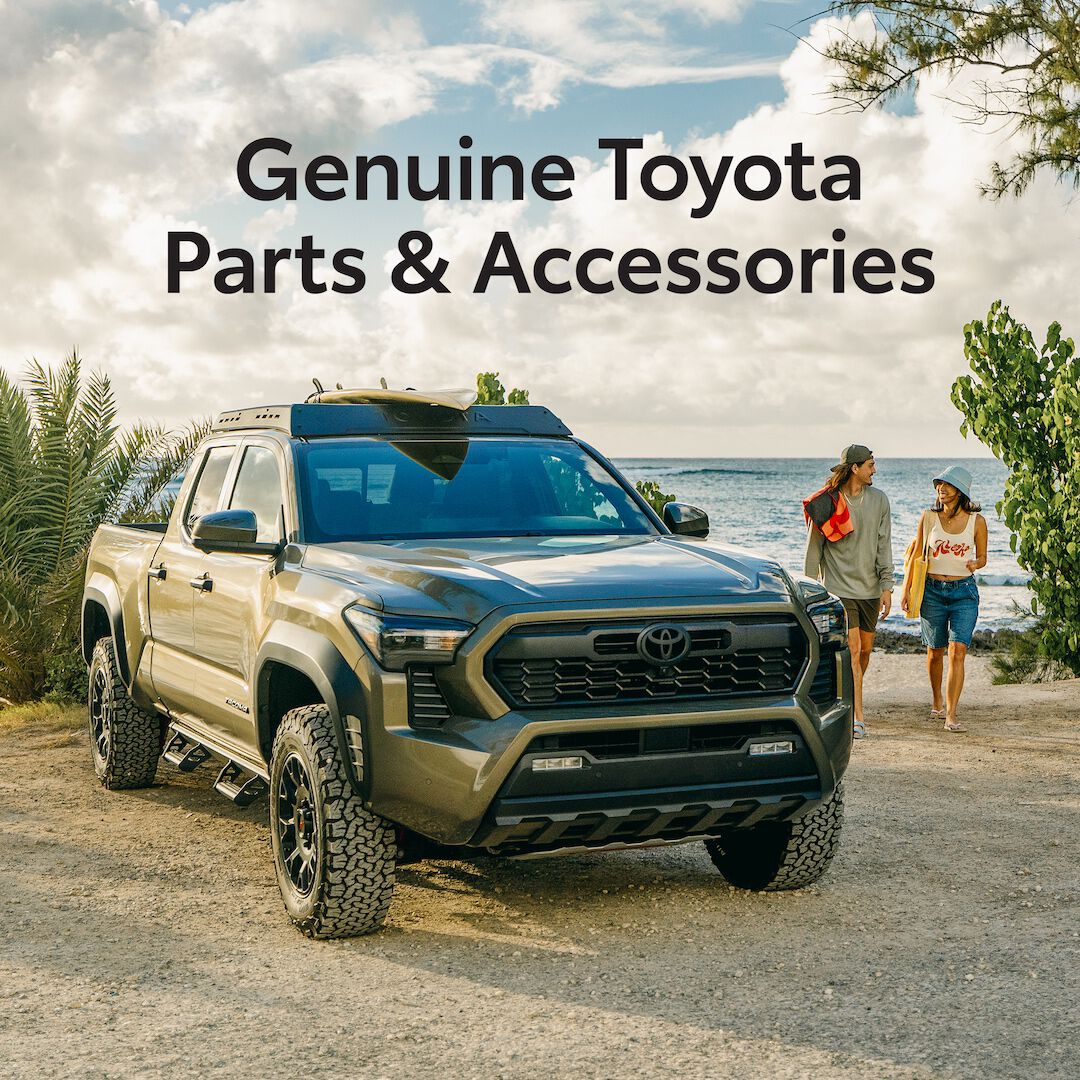 Couple returns from the beach to their accessorized 2024 Toyota Tacoma